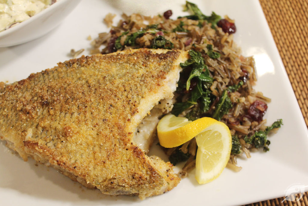 Lake-Harvested Wild Rice, Cranberry, and Kale Pilaf served with fresh-caught Bluegill