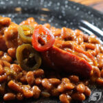 Grilled Bacon-Wrapped Chipotle Cheddar Cheese Stuffed Hotdogs & Beans