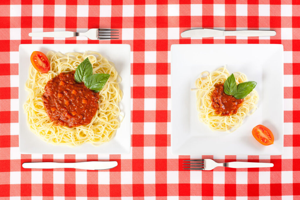 one portion of spaghetti with sauce vs. a big serving size of spaghetti and sauce