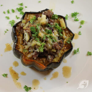 one serving (one half) stuffed acorn squash on a plate