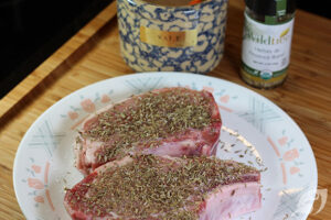 Herbes de Provence seasoned pork chops on a plate
