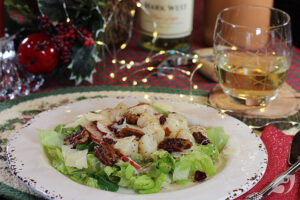 plate with lettuce greens, anjou Pear and seared sea scallops with candied pecans