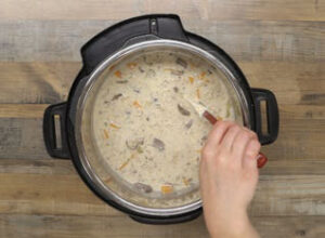 stir the cream into the cooked vegetable and broth mixture