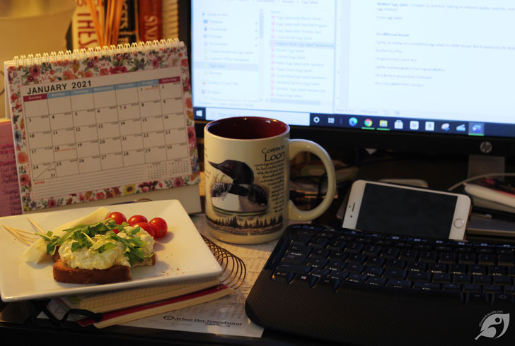 egg salad at my dest with computer monitor and keyboard in photo