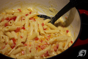 Step 4 - Add the mascarpone and slowly melt the cheese into the pepper and onion mixture, adding a little of the reserved pasta cooking water in (if needed) to make a creamy sauce.