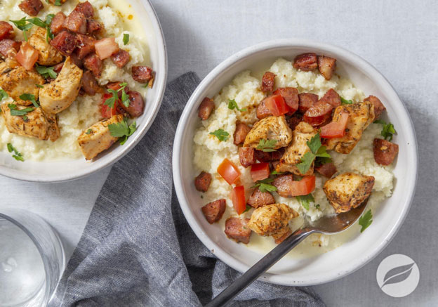 two bolws of Cajun Chicken & Cauliflower Grits plated