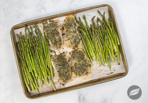 Garlic Parmesan Crusted Salmon on parchment on a sheetpan