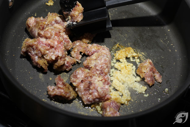 Chopped sausage in the skillet with Italian sausage seasoning and minced garlic