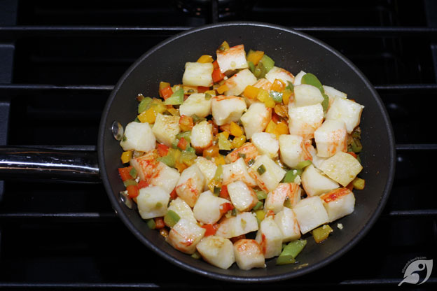 Sauté the peppers, butter, garlic and chunked lobster in a medium skillet over medium-low heat until it begins to brown.