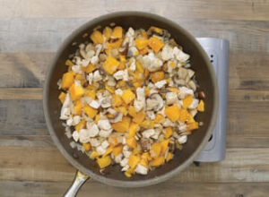 Step 1 - Butternut Squash & Mushroom Chicken (or Turkey) Pot Pies: Add chicken, onion, mushrooms, and butternut squash, sautéing about 10 minutes (if using raw diced chicken) until the chicken is no longer pink. If using leftover pre-cooked chicken or turkey, sautée the mixture for about 3-5 minutes until the onions turn translucent, and the mushrooms begin to brown.