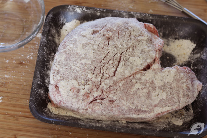 Prepare the sear seasoning by combining the flour, Rancher Rub [1], and garlic powder in a small bowl and whisk until blended. Then season and coat the roast with the sear seasoning mixture on all sides.