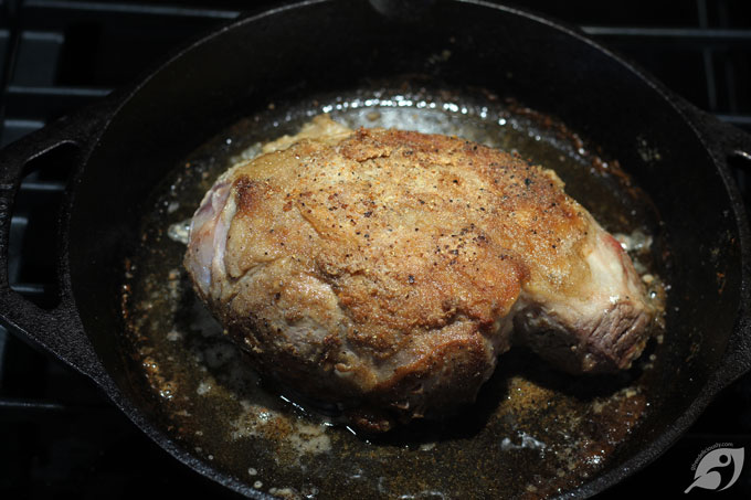 Heat a heavy dutch oven or cast iron pan on high heat on the stovetop, then add the seasoned spoon roast to the pot, fat side down, and let it sear for 3-4 minutes. Next, flip and sear on the opposite side an additional 3-4 minutes before removing the roast from the pot.