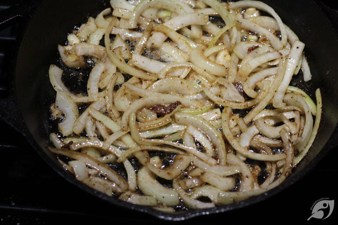 Using the same pot, reduce the heat to medium, then add 2 tablespoons of butter and the sliced onions to the dutch oven. Let the onions hang out for 2-3 minutes until they become translucent and begin to turn brown and caramelize.