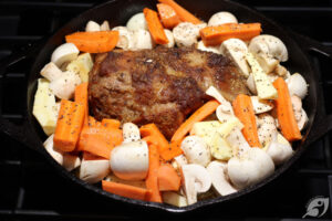 After 2+ hours have passed, add the veggies to the pot with the meat. Season lightly with salt and pepper, and add a bit more beef broth if necessary. Cover and return to the oven at 350°F for about 45 minutes longer until the veggies are tender when pierced.