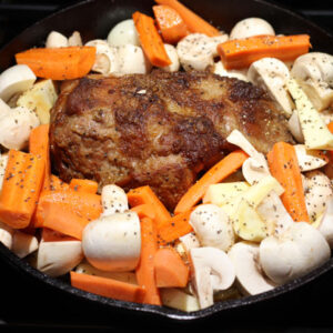 After 2+ hours have passed, add the veggies to the pot with the meat. Season lightly with salt and pepper, and add a bit more beef broth if necessary. Cover and return to the oven at 350°F for about 45 minutes longer until the veggies are tender when pierced.