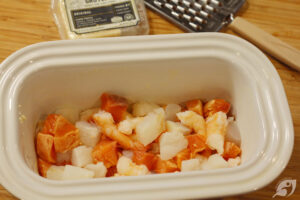 When thick, pour the hot mixture into the baking dish over the top of the fish and shrimp.