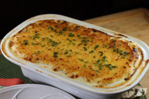 Remove briefly, sprinkle the top with extra cheese, breadcrumbs, or chopped parsley if desired, and return to the oven to bake for another 15 minutes or until golden.