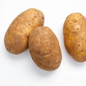 Three raw russet potatoes