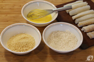 Fish fillets cut into approximately 1" x 1” sticks, 3-4 inches long. Flour, salt, and pepper are whisked together in a small shallow bowl. Egg whisked with water until frothy, in a separate bowl. Panko breadcrumbs in a third shallow bowl.