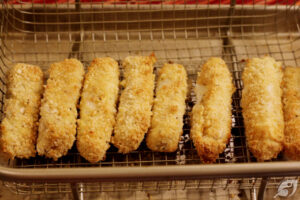 Air fry at 375°F (190°C) for approximately 6-7 minutes, flip over, and spray lightly with more coconut oil, then continue cooking for an additional 6-7 minutes or until the coating becomes golden brown and lightly crispy.