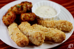 Fishsticks served with Homemade Better for You Tartar Sauceon a plate.