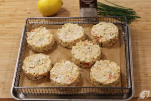 Place the formed cakes onto a parchment paper-covered air fryer rack.