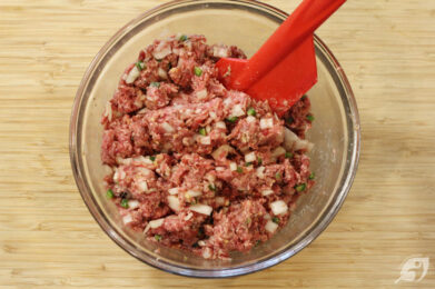 Add the onions, jalapeno, and grapeseed oil to a small frypan. Sauté over medium heat until the onions become translucent. Set aside to cool completely. Then fold gently into the ground beef and pork mixture.