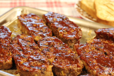 Increase the grill heat to high (450° to 500°F) and oil the grates. Cut the cooled meatloaf crosswise into even thick slices (about 1-inch thick). Place the pieces on the oiled grill grates and sear both sides of the exterior uncovered until grill marks appear for about 3-4 minutes per side. Brush each slice on top with the remaining ½ cup of barbecue sauce and continue to grill for about 1 minute until the sauce becomes slightly caramelized.