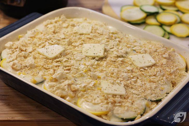 You will finish with the crackers on top. Then divide the remaining tablespoon of butter into thin pats, and place over the top before baking.