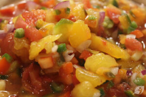 Remove a small amount of the salsa mixture for tasting with a spoon. Add more salt and vinegar if necessary and adjust the overall heat of the salsa. Once satisfied with the taste, cover and let the salsa mixture sit (at room temperature or chilled) for 1-2 hours for the flavors to blend and develop before serving.