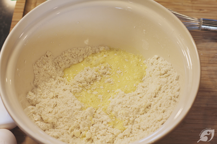 Then mix into the dry ingredients, stirring until the mixture holds together. Gradually add 1 to 3 additional tablespoons of cold water if necessary.