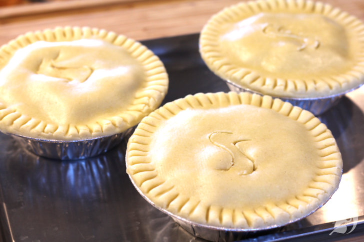 Seal the edges by fluting with a fork. Using a sharp knife, cut two small slits into the top of each crust for venting.