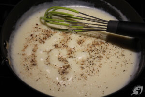 Gradually add milk, constantly whisking to avoid lumps. Bring the mixture to a boil while whisking it regularly. Reduce heat to low and allow the sauce to simmer for several minutes to thicken up.