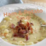 A beautifully captured image of a bowl filled with vibrant and aromatic Creamy Ham and Potato Soup garnished with crispy bacon pieces.
