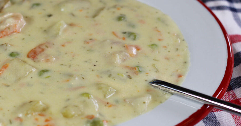 1200x628 px feature image closeup of a bowl of seafood chowder.