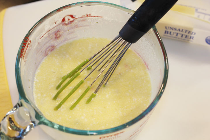 The photo shows the flour whisked into the measuring cup with the scaled milk and melted butter.
