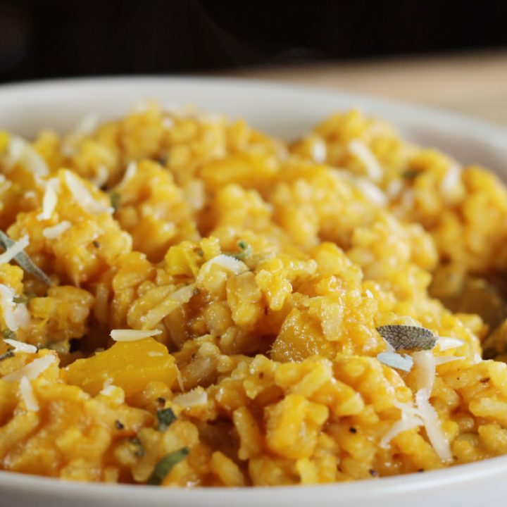 A beautifully captured image of a bowl filled with vibrant and aromatic Creamy, Dreamy Pumpkin Risotto.